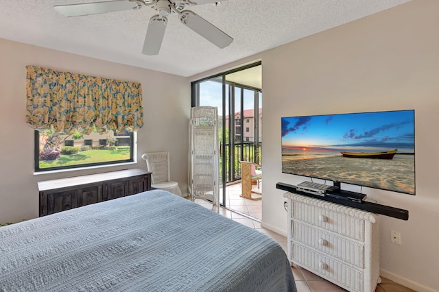 bedroom with access to exterior, tile patterned flooring, baseboards, a textured ceiling, and a ceiling fan