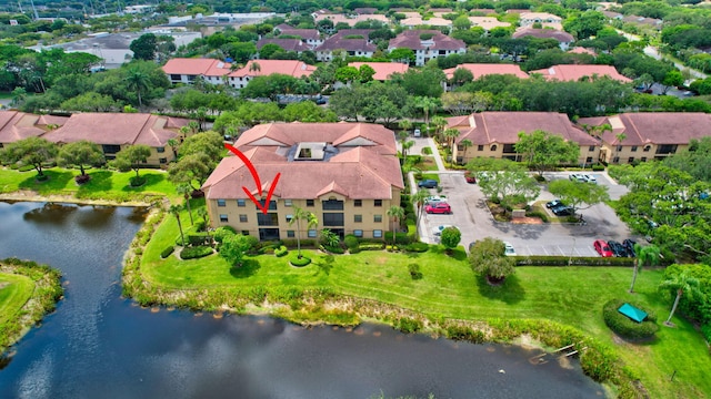 aerial perspective of suburban area with a large body of water
