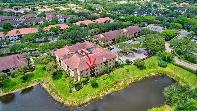 aerial view of residential area with a nearby body of water
