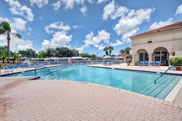 community pool with a patio