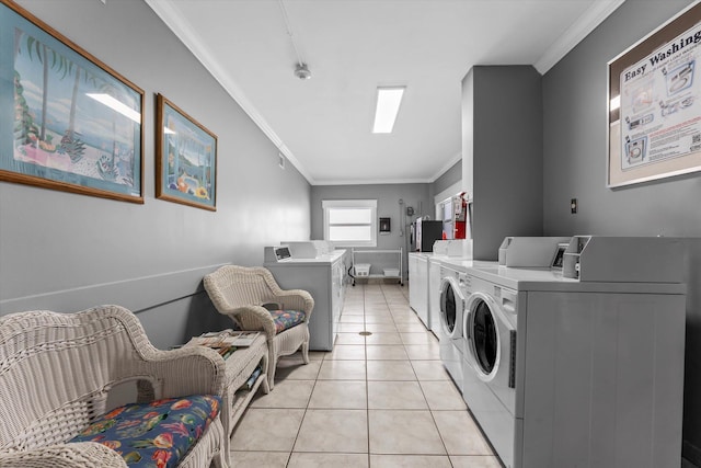 1701 S Ocean Dr Unit 903, Hollywood, FL 33019 - shared laundry featuring washer and clothes dryer, ornamental molding, and light tile patterned floors