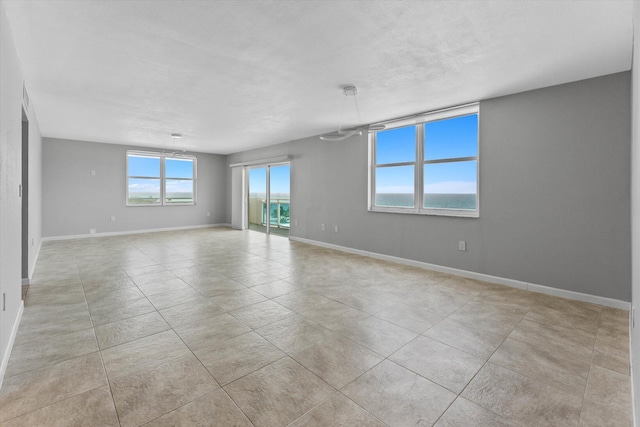 1701 S Ocean Dr Unit 903, Hollywood, FL 33019 - spare room with baseboards and light tile patterned floors