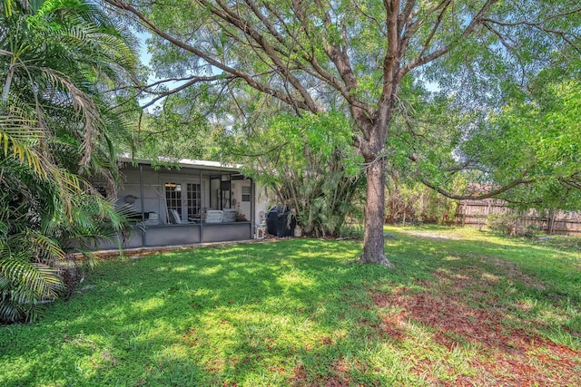 730 NE 23rd Pl, Pompano Beach, FL 33064 - view of yard with a sunroom