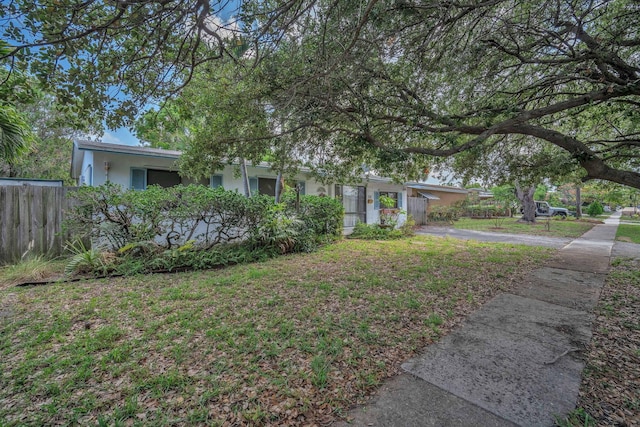 730 NE 23rd Pl, Pompano Beach, FL 33064 - view of front of property with stucco siding and fence