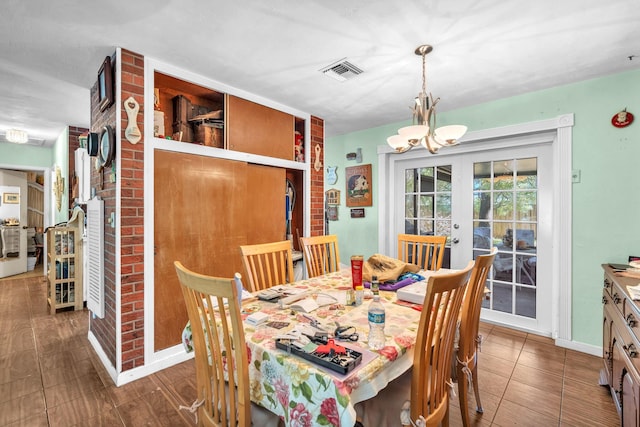 730 NE 23rd Pl, Pompano Beach, FL 33064 - dining room featuring a chandelier, french doors, and baseboards