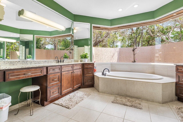 16737 Temple Blvd, Loxahatchee, FL 33470 - full bath with plenty of natural light, a garden tub, tile patterned flooring, vanity, and recessed lighting