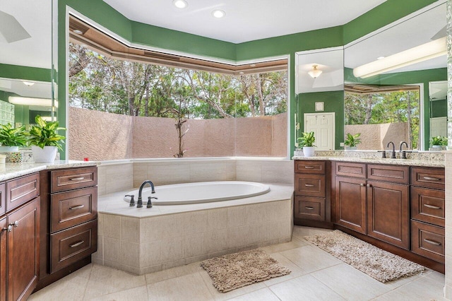 16737 Temple Blvd, Loxahatchee, FL 33470 - full bath with a garden tub, tile patterned floors, plenty of natural light, and vanity