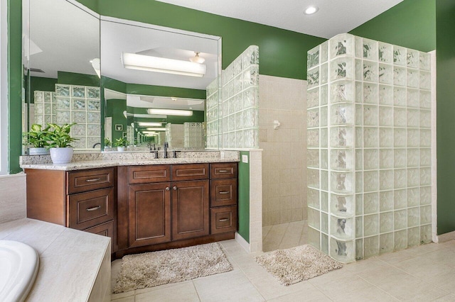 16737 Temple Blvd, Loxahatchee, FL 33470 - bathroom with a walk in shower, vanity, and tile patterned floors