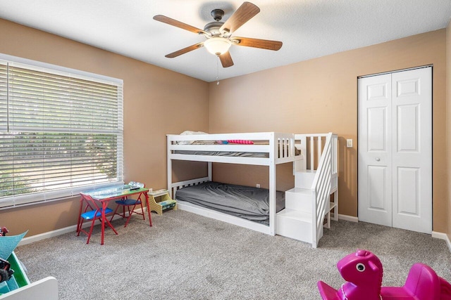 16737 Temple Blvd, Loxahatchee, FL 33470 - bedroom featuring carpet flooring, baseboards, a ceiling fan, and a closet