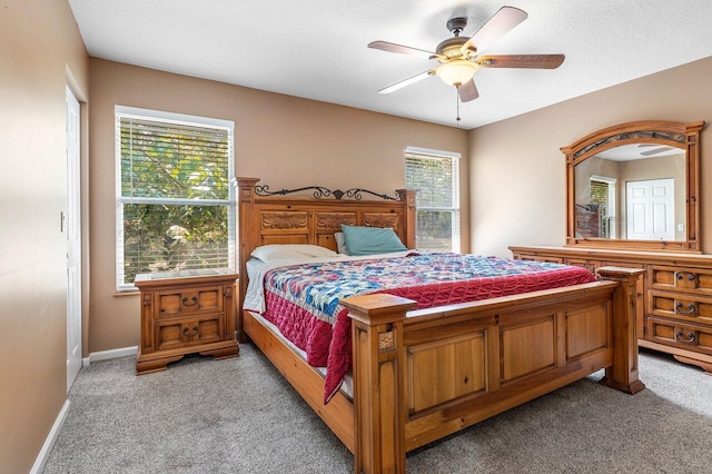 16737 Temple Blvd, Loxahatchee, FL 33470 - bedroom with light carpet, a ceiling fan, and baseboards