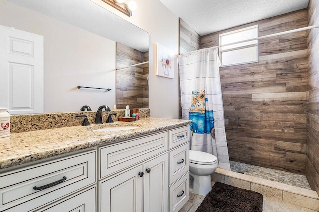 16737 Temple Blvd, Loxahatchee, FL 33470 - bathroom featuring a tile shower, vanity, toilet, and a textured ceiling