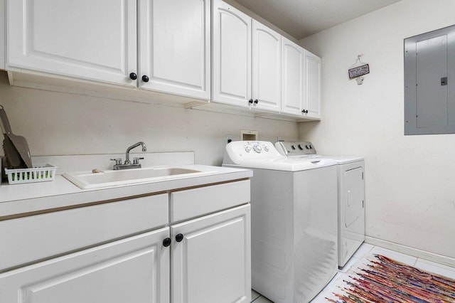 16737 Temple Blvd, Loxahatchee, FL 33470 - laundry area featuring electric panel, cabinet space, washer and dryer, baseboards, and light tile patterned floors