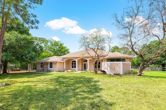 16737 Temple Blvd, Loxahatchee, FL 33470 - rear view of property with stucco siding