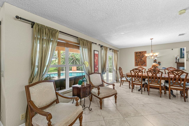 22075 Flower Dr, Boca Raton, FL 33428 - dining room with a textured ceiling, light tile patterned floors, and a chandelier