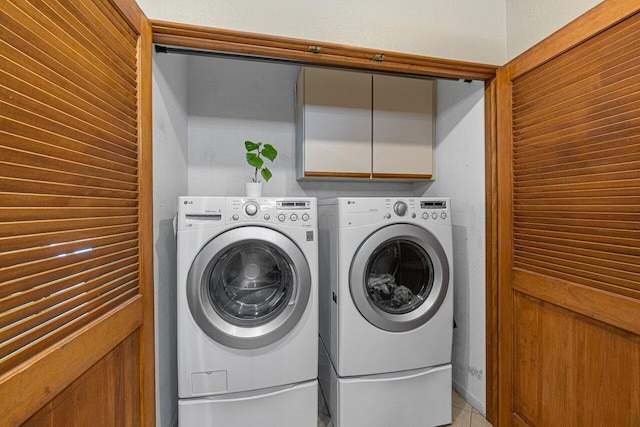 22075 Flower Dr, Boca Raton, FL 33428 - laundry area with washer and dryer and cabinet space