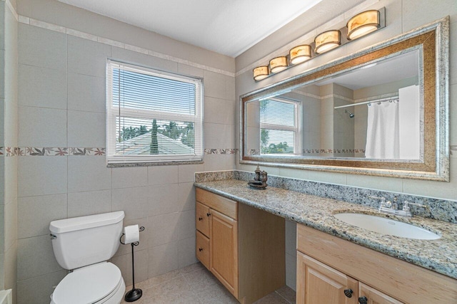 22075 Flower Dr, Boca Raton, FL 33428 - full bathroom with vanity, toilet, tile patterned floors, tile walls, and a shower with shower curtain