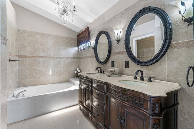 22075 Flower Dr, Boca Raton, FL 33428 - bathroom featuring tile walls, lofted ceiling, a bathtub, tile patterned floors, and a chandelier