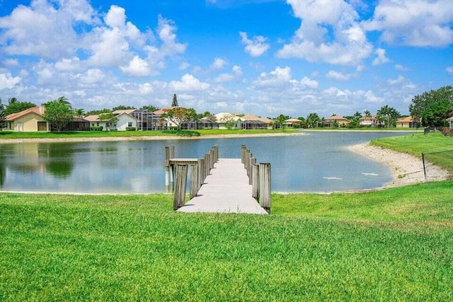 22075 Flower Dr, Boca Raton, FL 33428 - dock featuring a residential view, a water view, and a lawn