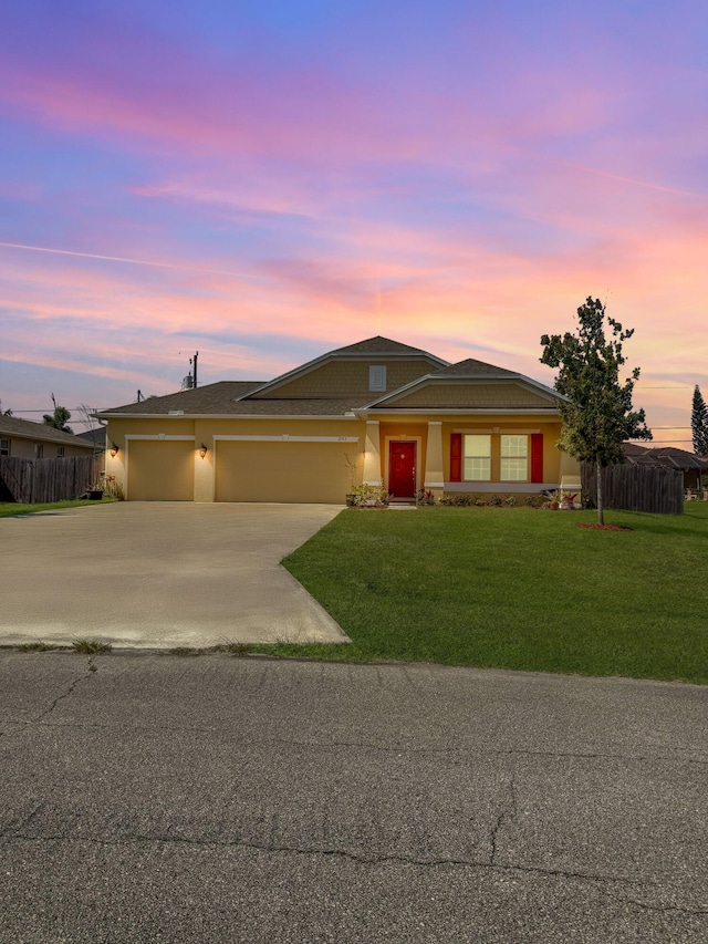 2313 SW Neal Rd, Port Saint Lucie, FL 34953 - view of front of property with driveway, an attached garage, and stucco siding