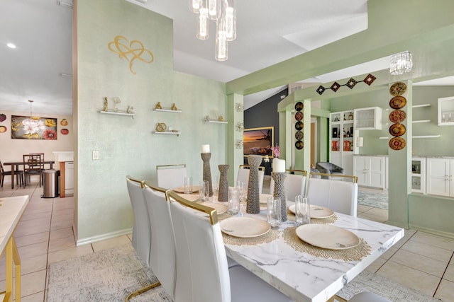 1985 SW Beard St, Port Saint Lucie, FL 34953 - dining area with light tile patterned floors, a chandelier, and baseboards