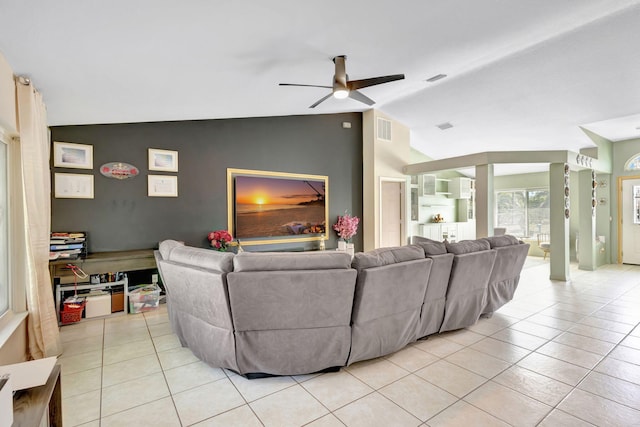 1985 SW Beard St, Port Saint Lucie, FL 34953 - living area featuring vaulted ceiling, ceiling fan, light tile patterned flooring, and an accent wall