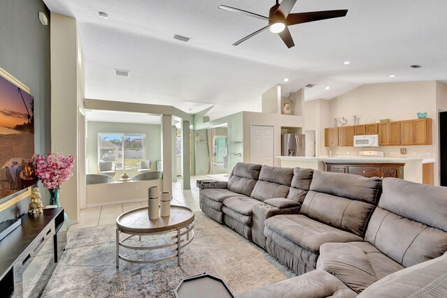 1985 SW Beard St, Port Saint Lucie, FL 34953 - living area featuring ceiling fan, lofted ceiling, light tile patterned flooring, and recessed lighting