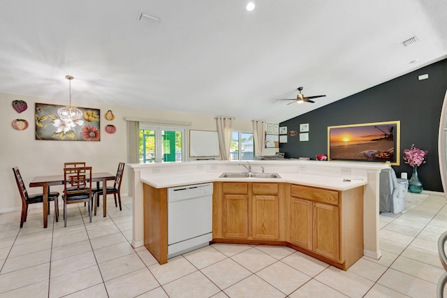 1985 SW Beard St, Port Saint Lucie, FL 34953 - kitchen with white dishwasher, a sink, light countertops, a ceiling fan, and vaulted ceiling