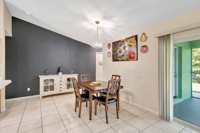 1985 SW Beard St, Port Saint Lucie, FL 34953 - dining space with light tile patterned floors, baseboards, and a chandelier