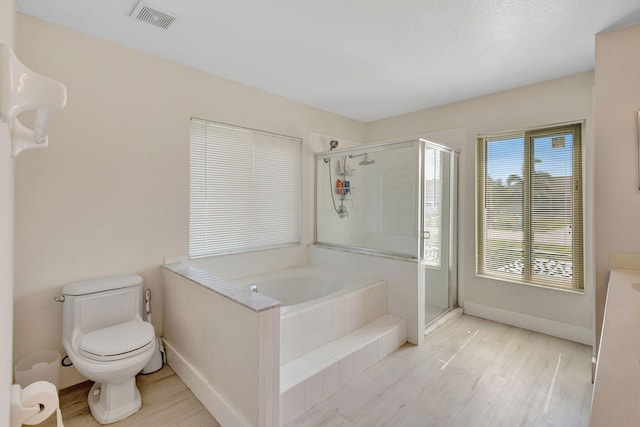 1985 SW Beard St, Port Saint Lucie, FL 34953 - full bathroom featuring a bath, a shower stall, toilet, baseboards, and wood finished floors