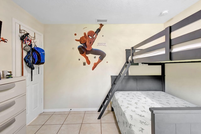 1985 SW Beard St, Port Saint Lucie, FL 34953 - bedroom with light tile patterned floors and baseboards