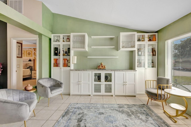 1985 SW Beard St, Port Saint Lucie, FL 34953 - bar area with lofted ceiling and light tile patterned floors
