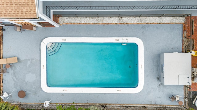 drone / aerial view of a pool