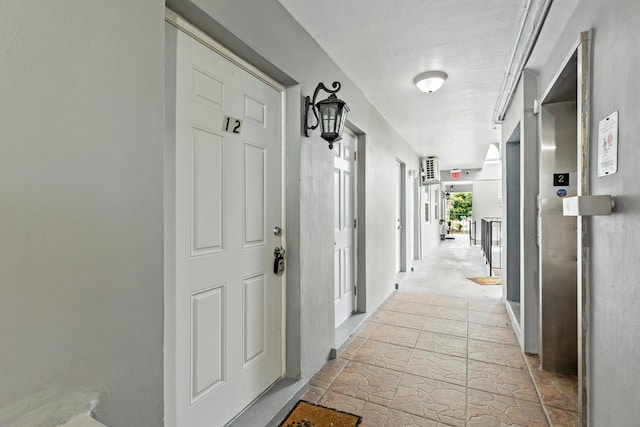 corridor with light stone finish floors