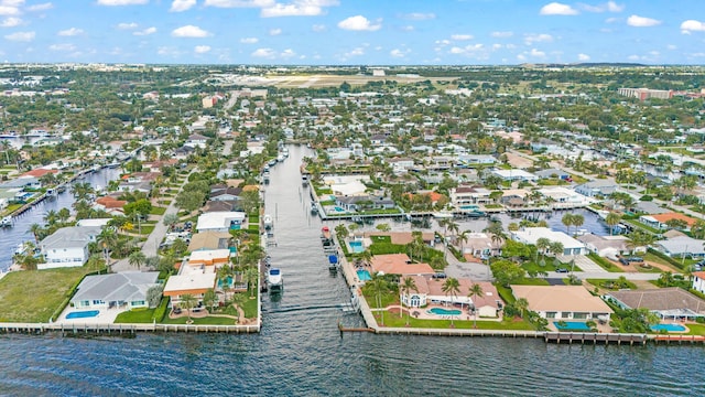 aerial view of residential area with a large body of water