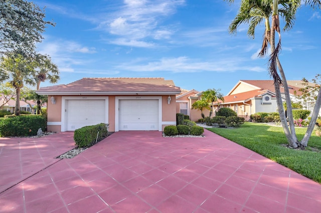 ranch-style house with stucco siding, concrete driveway, a tile roof, a front lawn, and a garage