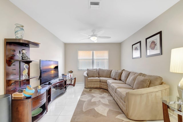 living room featuring a ceiling fan and light tile patterned floors