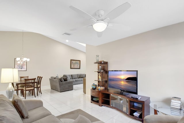 living room with a chandelier, a ceiling fan, vaulted ceiling, light tile patterned flooring, and baseboards
