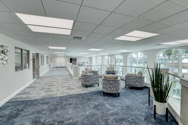community lobby featuring a paneled ceiling