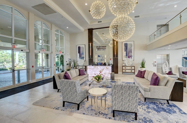 community lobby with a high ceiling and recessed lighting
