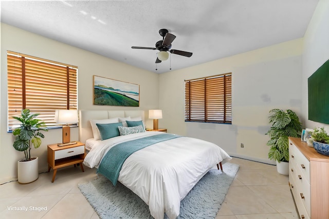 6120 Kings Gate Cir, Delray Beach, FL 33484 - bedroom featuring light tile patterned floors, baseboards, and ceiling fan