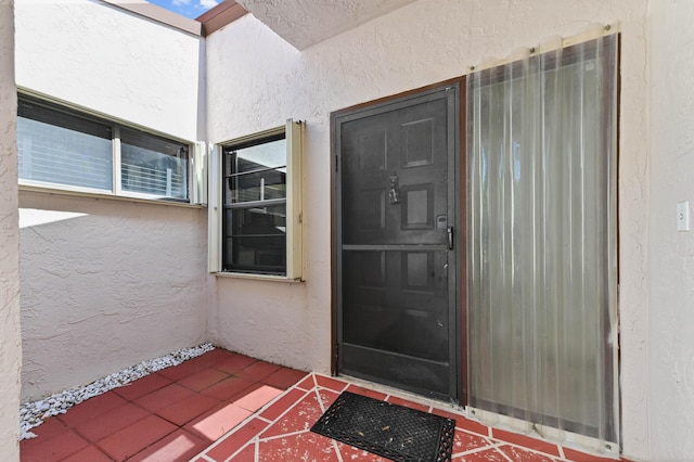 6120 Kings Gate Cir, Delray Beach, FL 33484 - view of exterior entry with stucco siding