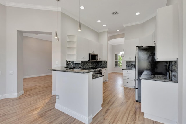 kitchen featuring open shelves, appliances with stainless steel finishes, ornamental molding, white cabinetry, and decorative backsplash