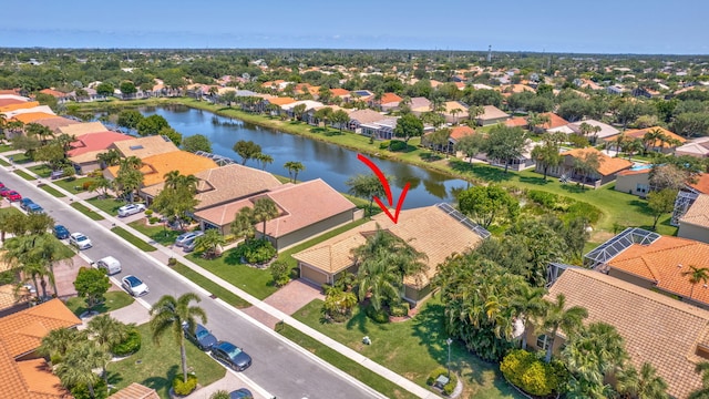 aerial perspective of suburban area with a nearby body of water