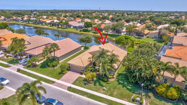 aerial view of residential area with a large body of water