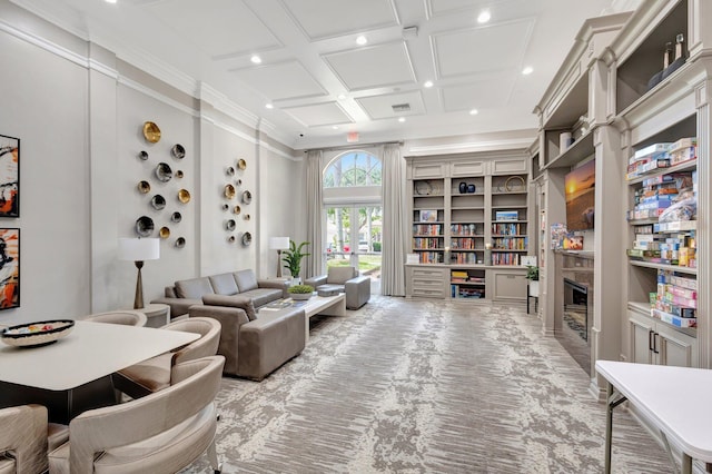 living room featuring recessed lighting, crown molding, a glass covered fireplace, and coffered ceiling