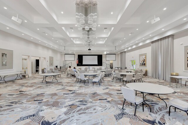 lobby with a towering ceiling, recessed lighting, and coffered ceiling