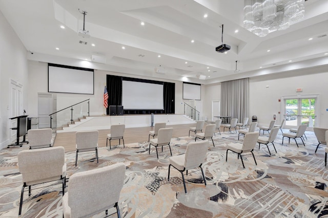 common area with a high ceiling, stairway, and recessed lighting