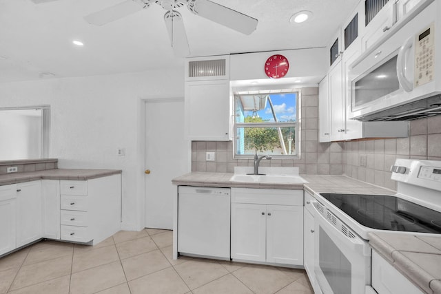 2230 NE 62nd St, Fort Lauderdale, FL 33308 - kitchen featuring white appliances, a sink, ceiling fan, white cabinets, and recessed lighting