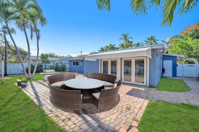 2230 NE 62nd St, Fort Lauderdale, FL 33308 - view of patio with a gate, outdoor dining area, and grilling area
