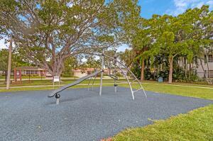 2230 NE 62nd St, Fort Lauderdale, FL 33308 - communal playground with a lawn